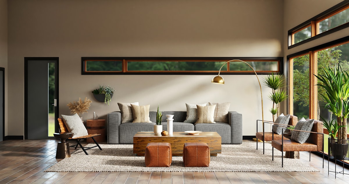 Warm open-plan living room with grey sofa and terracotta leather seating